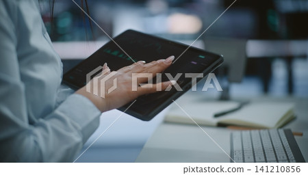 Professional Hands Using Tablet to Monitor Stock Market Trends and Green Candlestick Charts Professional Hands Using Tablet to Monitor Stock Market Trends and Green Candlestick Charts 141210856