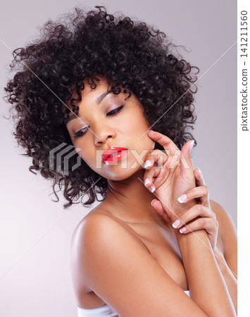 Skincare, beauty and confident black woman with makeup, afro and luxury aesthetic in studio. Dermatology, facial cosmetics and serious African model girl in red lipstick isolated on white background Skincare, beauty and confident black woman with makeup, afro and luxury aesthetic in studio. Dermatology, facial cosmetics and serious African model girl in red lipstick isolated on white background 141211560
