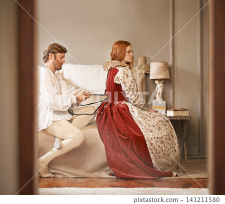 Couple, noble and bedroom with dressing, marriage and luxury with royal relationship. King, queen and royalty with palace bed chamber, wealth and historical ruler together with bonding and lady care Couple, noble and bedroom with dressing, marriage and luxury with royal relationship. King, queen and royalty with palace bed chamber, wealth and historical ruler together with bonding and lady care 141211580