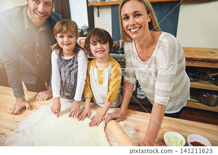 Portrait, smile and family baking in kitchen together, bonding and happy for learning in home. Face, mother and father with kids cooking pizza, teaching and help parents with flour dough at table Portrait, smile and family baking in kitchen together, bonding and happy for learning in home. Face, mother and father with kids cooking pizza, teaching and help parents with flour dough at table 141211623