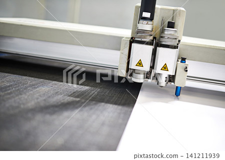 Closeup, machinery or technology in printing, factory or paper in printer, workshop or manufacturing. CNC, metal or automation in engineering, design or industry as speed, tools or production Closeup, machinery or technology in printing, factory or paper in printer, workshop or manufacturing. CNC, metal or automation in engineering, design or industry as speed, tools or production 141211939