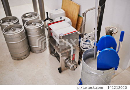 Brewery, tank and assembly line with machine for production for manufacturing process, distillation and beer in keg. Industrial industry, closeup and brewing drum in factory, warehouse or distillery Brewery, tank and assembly line with machine for production for manufacturing process, distillation and beer in keg. Industrial industry, closeup and brewing drum in factory, warehouse or distillery 141212020