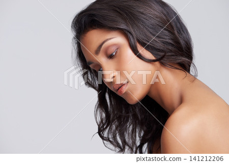 Hair care, confident and woman in studio with beauty, wellness and natural facial routine. Mockup, health and face of female person with cosmetic dermatology treatment for glow by gray background. Hair care, confident and woman in studio with beauty, wellness and natural facial routine. Mockup, health and face of female person with cosmetic dermatology treatment for glow by gray background. 141212206