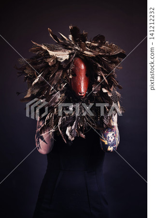 Halloween, skull and woman with tattoo in studio scary aesthetic, artistic horror or abstract mask on dark background. Surreal, nightmare and bones with leaves for creative, culture or unique person 141212232