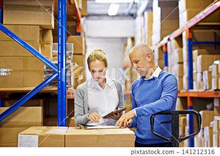 Technology, checklist and business people in distribution warehouse for logistics, supply chain and cardboard box. Package, ecommerce and employees with tablet for shipping, cargo and stock taking Technology, checklist and business people in distribution warehouse for logistics, supply chain and cardboard box. Package, ecommerce and employees with tablet for shipping, cargo and stock taking 141212316