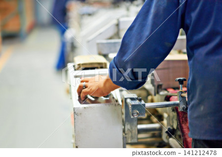 Machine, worker or hand on control panel in factory for printing process, manufacturing or production. Closeup, cnc operator or employee in workshop with electronic controller for commercial industry Machine, worker or hand on control panel in factory for printing process, manufacturing or production. Closeup, cnc operator or employee in workshop with electronic controller for commercial industry 141212478