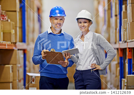 Portrait, warehouse or man with woman, tablet or documents with shipping or industry. Clipboard, inventory or manufacturing with teamwork or boxes with stock or logistics with storage or supply chain Portrait, warehouse or man with woman, tablet or documents with shipping or industry. Clipboard, inventory or manufacturing with teamwork or boxes with stock or logistics with storage or supply chain 141212639