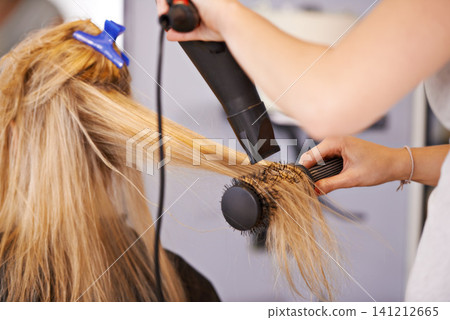 Brush, hair and hands with dryer for beauty, people at hairdresser for haircare and maintenance with heat treatment. Electric appliance, styling and blow drying for makeover with cosmetic care Brush, hair and hands with dryer for beauty, people at hairdresser for haircare and maintenance with heat treatment. Electric appliance, styling and blow drying for makeover with cosmetic care 141212665