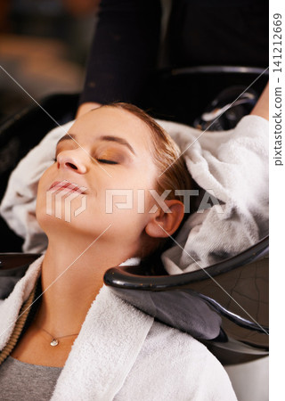 Towel, washing and woman at sink with hairdresser for professional haircare, cleaning or luxury treatment. Grooming, hair care and client at salon basin with soap, water and small business service Towel, washing and woman at sink with hairdresser for professional haircare, cleaning or luxury treatment. Grooming, hair care and client at salon basin with soap, water and small business service 141212669