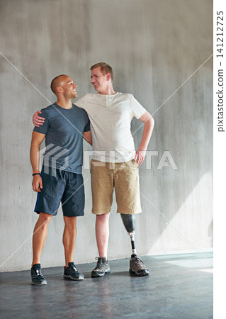 Physiotherapist, hug and man with disability with healthcare and wellness professional with amputee. Exercise, physio and workout for health and support with physical therapy in studio with balance Physiotherapist, hug and man with disability with healthcare and wellness professional with amputee. Exercise, physio and workout for health and support with physical therapy in studio with balance 141212725