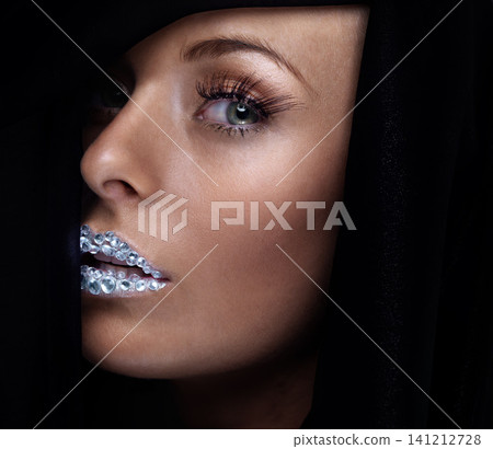 Beauty, portrait and woman with crystal on lips in studio with jewelry on skin isolated on a black background. Diamond, face and serious model with creative makeup for fashion, cosmetics or eyelashes Beauty, portrait and woman with crystal on lips in studio with jewelry on skin isolated on a black background. Diamond, face and serious model with creative makeup for fashion, cosmetics or eyelashes 141212728