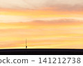 A minimalist landscape with layers of sunset sky and clouds; background material with copy space. 141212738