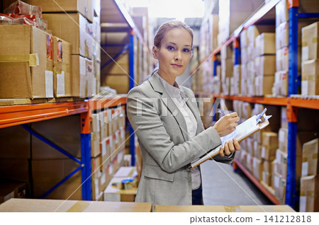 Portrait, clipboard or business woman at a warehouse for logistics, planning or inventory. Face, factory or employee with cargo, checklist or stock storage compliance documents for quality assurance 141212818
