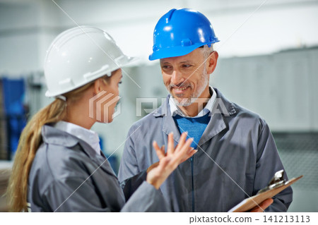 Smile, factory and team of engineers in discussion with checklist for industrial inventory. Warehouse, collaboration and happy people planning with mature supervisor for building or manufacturing Smile, factory and team of engineers in discussion with checklist for industrial inventory. Warehouse, collaboration and happy people planning with mature supervisor for building or manufacturing 141213113
