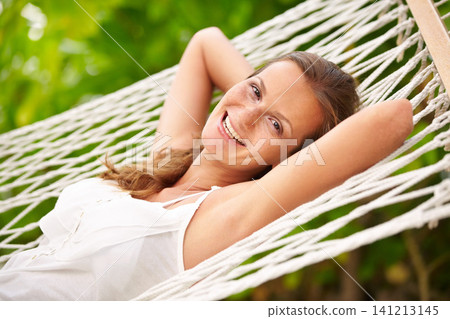 Portrait, woman and relax on hammock in nature, happy and vacation in summer on tropical island. Young person, smile and face with wellness at beach resort, peace and holiday for leisure in outdoor 141213145