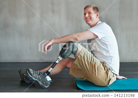 Man, amputee and workout with prosthetic legs for fitness, wellness and muscle health on floor. Happy person with disability and ready or on break for exercise, training and physio strength on ground Man, amputee and workout with prosthetic legs for fitness, wellness and muscle health on floor. Happy person with disability and ready or on break for exercise, training and physio strength on ground 141213198