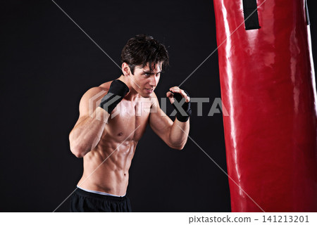 Man, punching bag and martial arts with exercise, training and fighter with gloves and wellness with power. Boxer, practice and athlete with fitness and workout with endurance, healthy and progress Man, punching bag and martial arts with exercise, training and fighter with gloves and wellness with power. Boxer, practice and athlete with fitness and workout with endurance, healthy and progress 141213201
