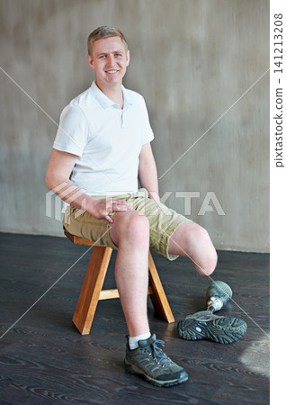 Man, happy and amputee with prosthetic leg in gym sitting, residual limb for balance. Workout, physiotherapy and fitness for wellness or male person with disability, exercise and rehabilitation Man, happy and amputee with prosthetic leg in gym sitting, residual limb for balance. Workout, physiotherapy and fitness for wellness or male person with disability, exercise and rehabilitation 141213208
