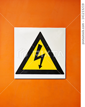 Warning, sign and voltage with triangle or symbol for alert, precaution or safety at warehouse or factory. Hazard poster or shape in beware of high wattage, electricity or power surge on mockup space Warning, sign and voltage with triangle or symbol for alert, precaution or safety at warehouse or factory. Hazard poster or shape in beware of high wattage, electricity or power surge on mockup space 141213219