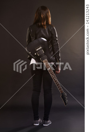 Woman, guitar and fashion for musical instrument, sound and trendy for retro and style on dark background. Young person or musician for creative, funky and edgy for bold with leather jacket for rock Woman, guitar and fashion for musical instrument, sound and trendy for retro and style on dark background. Young person or musician for creative, funky and edgy for bold with leather jacket for rock 141213243