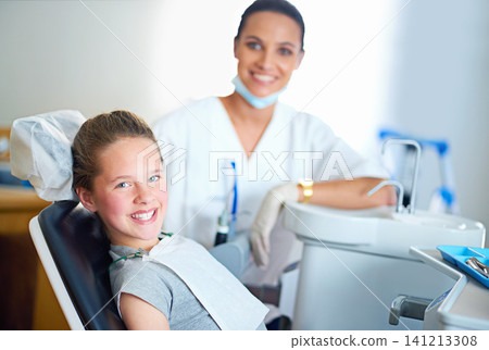 Happy, dentist and portrait of child in chair for cleaning, teeth whitening and wellness. Healthcare, dentistry and woman and girl with tools for dental hygiene, oral care and medical consultation Happy, dentist and portrait of child in chair for cleaning, teeth whitening and wellness. Healthcare, dentistry and woman and girl with tools for dental hygiene, oral care and medical consultation 141213308