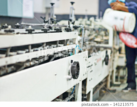 Machine, distribution and factory with production for automation, supply chain or manufacturing. Closeup of machinery or making of industry product for service, export or import business at warehouse Machine, distribution and factory with production for automation, supply chain or manufacturing. Closeup of machinery or making of industry product for service, export or import business at warehouse 141213575