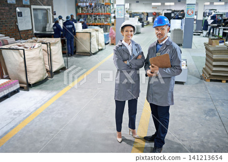 Manager, smile and portrait in factory for production process, industry and manufacturing for distribution. Workers in uniform together in packaging plant for printing and stock in bag for supplier Manager, smile and portrait in factory for production process, industry and manufacturing for distribution. Workers in uniform together in packaging plant for printing and stock in bag for supplier 141213654