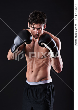 Man, portrait and boxing gloves in studio for exercise fight or martial arts training or performance, black background or gym. Male person, face and self defence fitness for athlete, mockup or punch Man, portrait and boxing gloves in studio for exercise fight or martial arts training or performance, black background or gym. Male person, face and self defence fitness for athlete, mockup or punch 141213655