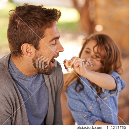 Happy father, food and girl feeding in morning on bench with family for breakfast, nutrition and happiness. Dad, child and meal outdoors for food, health and sharing with open mouth, smile and joy. Happy father, food and girl feeding in morning on bench with family for breakfast, nutrition and happiness. Dad, child and meal outdoors for food, health and sharing with open mouth, smile and joy. 141213760