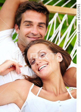Portrait, happy couple and relax on hammock in nature, love and vacation in summer on tropical island. Young man, woman and face in marriage at beach resort, peace and holiday for leisure outdoor Portrait, happy couple and relax on hammock in nature, love and vacation in summer on tropical island. Young man, woman and face in marriage at beach resort, peace and holiday for leisure outdoor 141213761