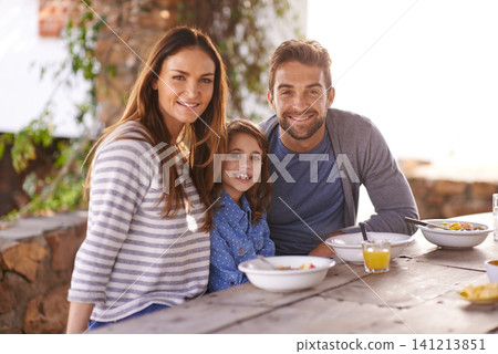 Happy family, portrait and breakfast with juice, smile and garden for vacation, nutrition and bonding. Father, mother and daughter at table in morning for summer holiday, together and healthy food. Happy family, portrait and breakfast with juice, smile and garden for vacation, nutrition and bonding. Father, mother and daughter at table in morning for summer holiday, together and healthy food. 141213851
