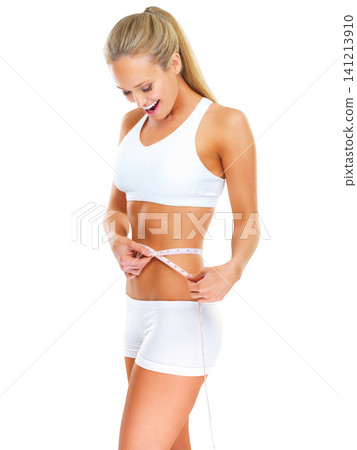 Weight loss, measuring tape and woman in studio for wellness, healthy diet and fitness with white background. Happiness, stomach and female person for results in exercise, waist and body goals Weight loss, measuring tape and woman in studio for wellness, healthy diet and fitness with white background. Happiness, stomach and female person for results in exercise, waist and body goals 141213910