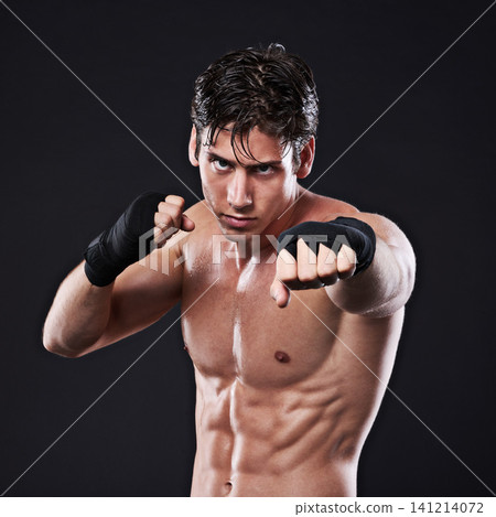 Fitness, portrait and man punching in studio for exercise, challenge or competition training for gym. Power, muscle or boxing champion at mma workout with confidence, fight and black background Fitness, portrait and man punching in studio for exercise, challenge or competition training for gym. Power, muscle or boxing champion at mma workout with confidence, fight and black background 141214072