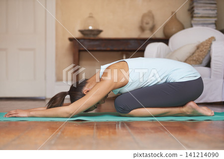 Yoga, child pose and woman in home for training, exercise and zen mindset on floor. Fitness, mental health and person with sports mat for wellness, flexibility and pilates in living room for balance 141214090