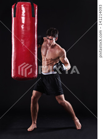 Man, gloves and boxing bag for fitness practice or cardio workout for health, fighter or black background. Male person, punch and martial arts training in studio on mockup for muscle, gym or fist Man, gloves and boxing bag for fitness practice or cardio workout for health, fighter or black background. Male person, punch and martial arts training in studio on mockup for muscle, gym or fist 141214093