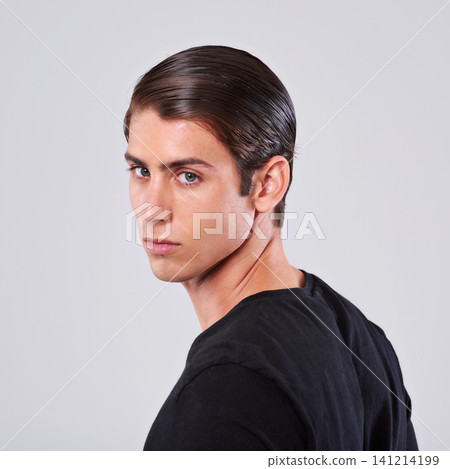 Handsome man, portrait and fashion with hairstyle, tshirt or hygiene on a gray studio background. Face of attractive and young male person or model with cool hairdo or salon treatment on mockup space Handsome man, portrait and fashion with hairstyle, tshirt or hygiene on a gray studio background. Face of attractive and young male person or model with cool hairdo or salon treatment on mockup space 141214199