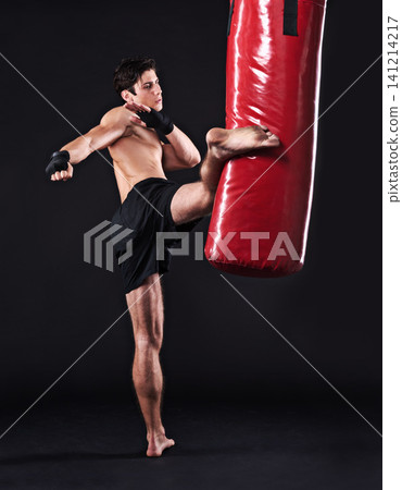 Kickboxing, challenge and man with training, fitness and exercise on a dark studio background. Healthy person, mockup space and model with endurance and progress with workout and wellness with cardio Kickboxing, challenge and man with training, fitness and exercise on a dark studio background. Healthy person, mockup space and model with endurance and progress with workout and wellness with cardio 141214217