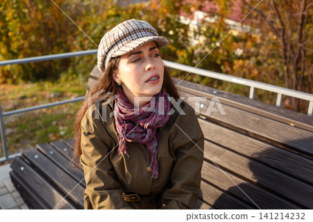 Woman gesturing while looking at smartphone Woman gesturing while looking at smartphone 141214232