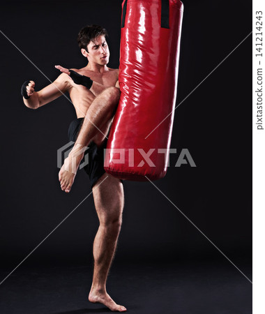 Kickboxing, bag and man with training, fitness and exercise on a dark studio background. Healthy person, mockup space and model with endurance and practice with workout and wellness with challenge Kickboxing, bag and man with training, fitness and exercise on a dark studio background. Healthy person, mockup space and model with endurance and practice with workout and wellness with challenge 141214243