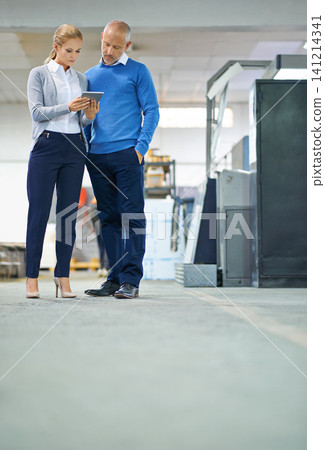 Mature, man and woman with tablet in factory for production monitoring, inventory or order management and inspection. Team, digital tech and warehouse for printing material and distribution industry. 141214341