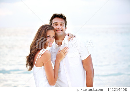Happy couple, portrait and hug by beach in nature, love and travel on honeymoon adventure in outdoor. Young man, woman and face of bonding in marriage, sea and together on summer getaway in cape town Happy couple, portrait and hug by beach in nature, love and travel on honeymoon adventure in outdoor. Young man, woman and face of bonding in marriage, sea and together on summer getaway in cape town 141214408