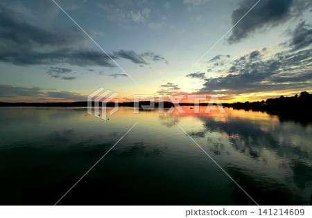 Vibrant Sunset Sky over Lake Horizon Vibrant Sunset Sky over Lake Horizon 141214609