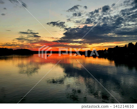 Vibrant Sunset Sky over Lake Horizon Vibrant Sunset Sky over Lake Horizon 141214610