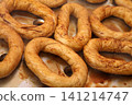 Making Turkish sesame bagels. Simit 141214747
