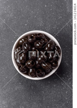 Black canned olives without pits for salads and snacks. Black olives without pits Black canned olives without pits for salads and snacks. Black olives without pits 141214814