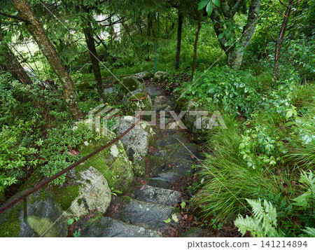 A scene from a walking path in the Okuhida Onsen hot spring resort town on a rainy summer day. 141214894