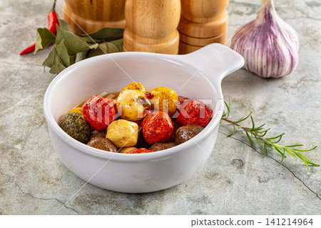 Colorful shanklish cheese balls in white ceramic bowl with garlic and herbs Colorful shanklish cheese balls in white ceramic bowl with garlic and herbs 141214964