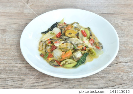 spicy stir fried mussel and basil leaf with slice onion couple chili on plate spicy stir fried mussel and basil leaf with slice onion couple chili on plate 141215015