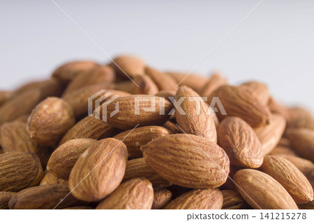Nutritious nuts with fragrant, roasted almond pieces piled high. Nutritious nuts with fragrant, roasted almond pieces piled high. 141215278