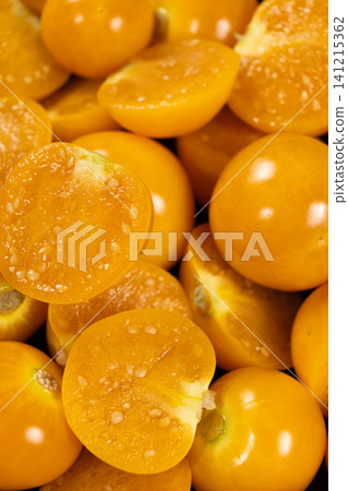 Macro texture of fresh golden berries physalis showing inner seeds and juicy flesh Macro texture of fresh golden berries physalis showing inner seeds and juicy flesh 141215362